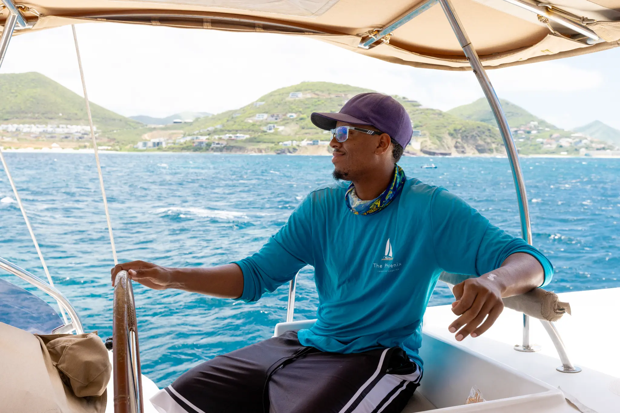 Captain Rasheed at the helm of The Phoenix catamaran, St. Maarten