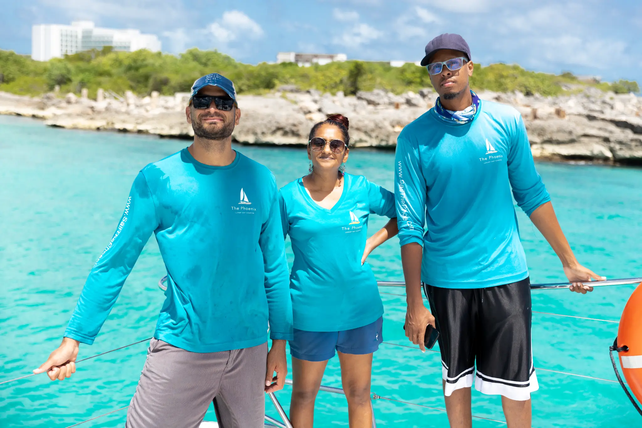 Sail The Phoenix crew — Guido, Rasheed, and Camille in uniform
